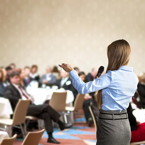 business woman is speaking on conference.